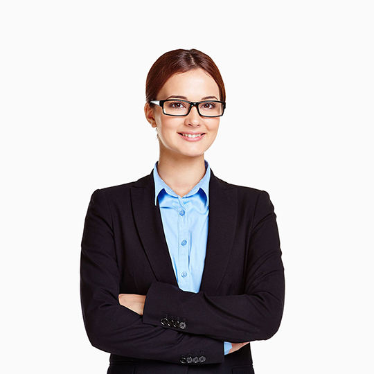 Portrait of young businesswoman in eyeglasses looking at camera